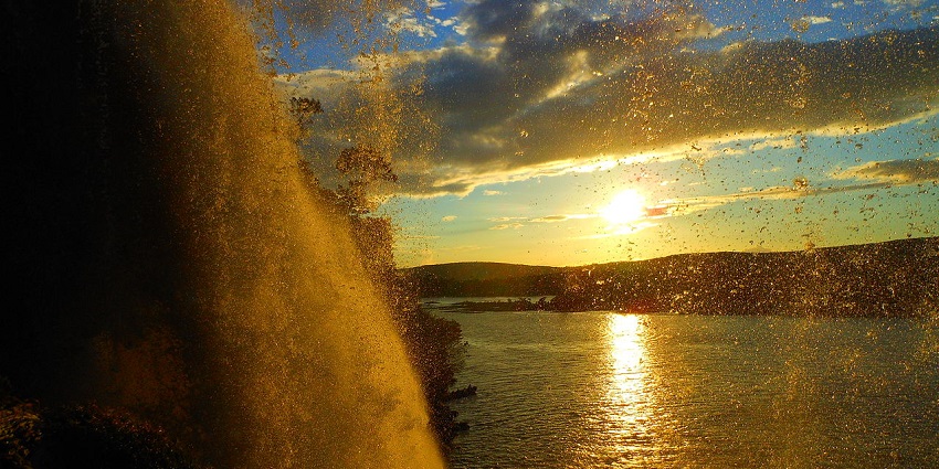 Water droplets turn reddish during a scenic sunset at Salto Hacha in Canaima Lagoon, Venezuela