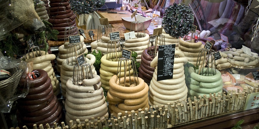 A traditional Belgian market with fresh produce, cheeses, baked goods, and friendly vendors.