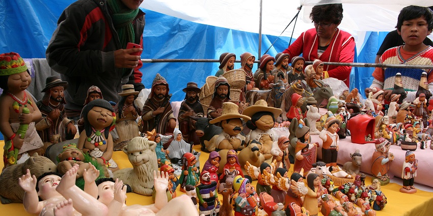 Vendors display handcrafted figurines at a Peruvian market during one of the festivals in Peru.