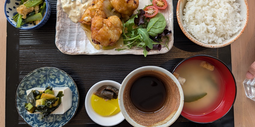 Japanese meal with sushi, tempura, and soup on a table, tasty food-related things to do in Kasukabe.