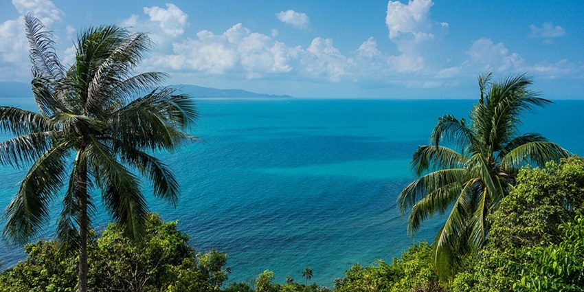 Ride a scooter to Mango Viewpoint and witness a stunning sunset over Koh Tao’s forested hills and bays.