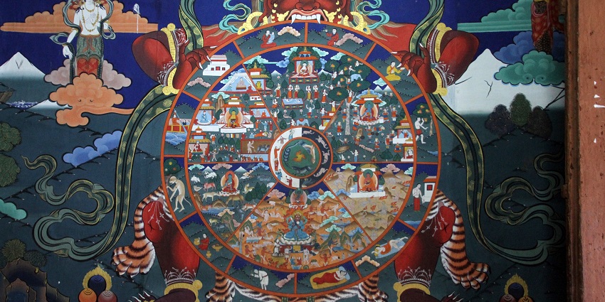 A Buddhist painting showing peaceful figures and detailed symbols, representing spiritual themes.