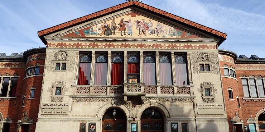 Front facade of Aarhus Teater in Denmark, showcasing its ornate Art Nouveau architecture.