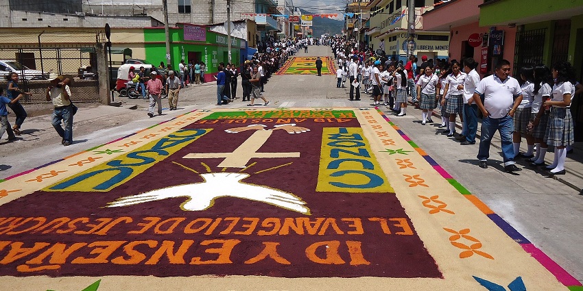 Traditional carpet art made from colored sawdust decorates the streets during Semana Santa in Honduras.