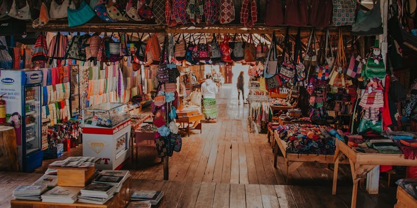 Visitors exploring a bag shop at Courthouse Market, a fun thing to do in Broome, Australia
