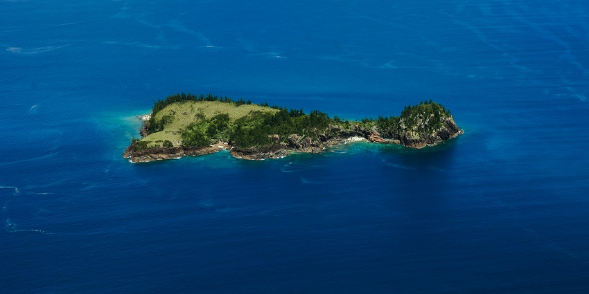 Pristine marine paradise with coral gardens, clear waters, and world-renowned diving sites
