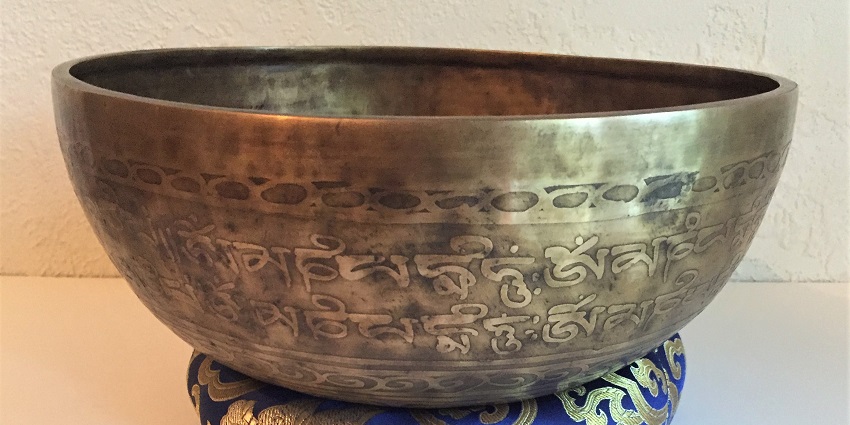 An image of traditional singing bowls in Kathmandu, one of the spiritual things to buy in Nepal.