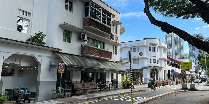 Curved, white buildings with geometric shapes, iconic things to do in Tiong Bahru.