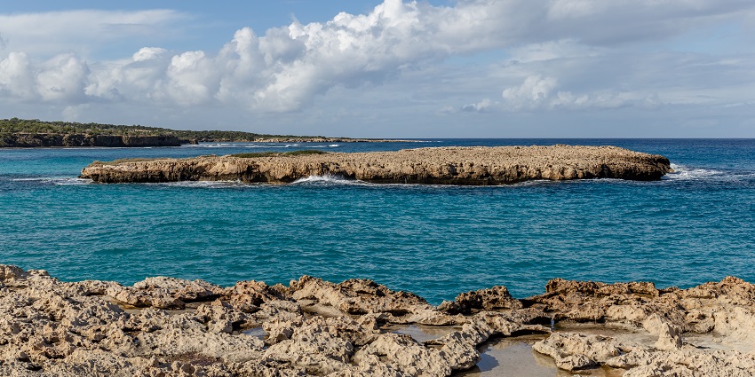 A beautiful island surrounded by the crystal-clear waters of the Blue Lagoon in Cyprus.