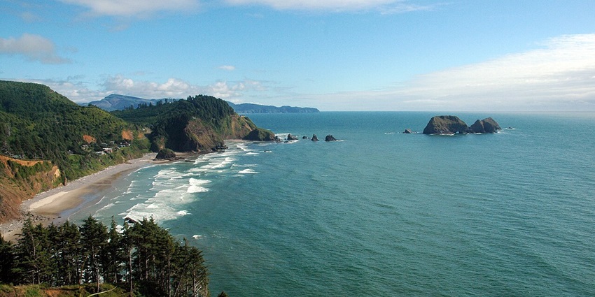 Historic Cape Meares Lighthouse perched on a cliff overlooking the Pacific Ocean.