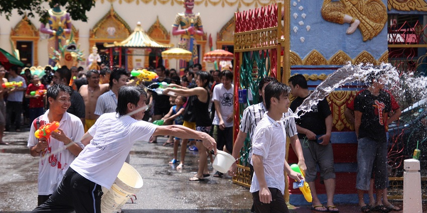 People splashed water on each other during the Songkran celebration in the streets