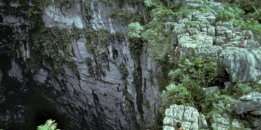 An image of the Cave of Swallows with steep limestone walls in caves in Mexico.