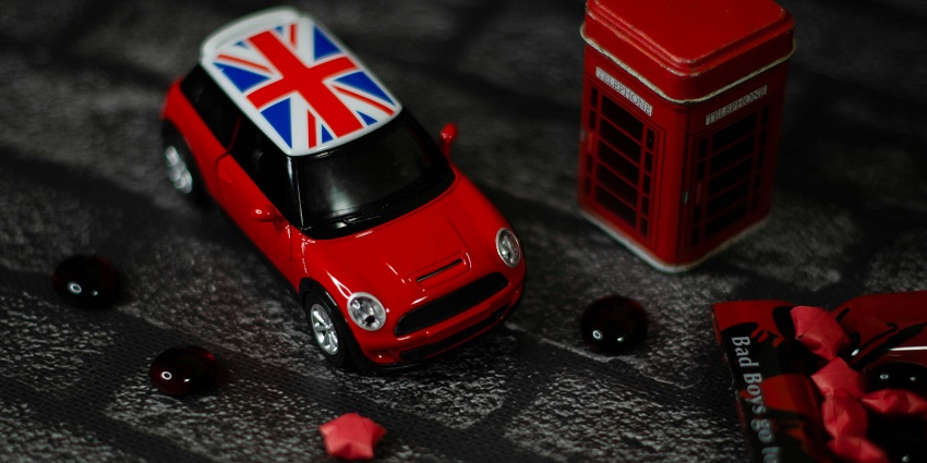 An image of the Union Jack, which is printed on a miniature car toy.