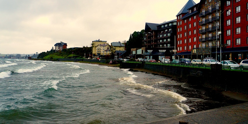 Lakeside promenade in Puerto Varas, featuring benches and pathways along the shoreline