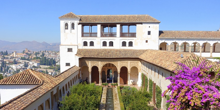Generalife’s lush gardens, pools, and Islamic design offer peaceful retreat within Granada’s historic Alhambra complex.