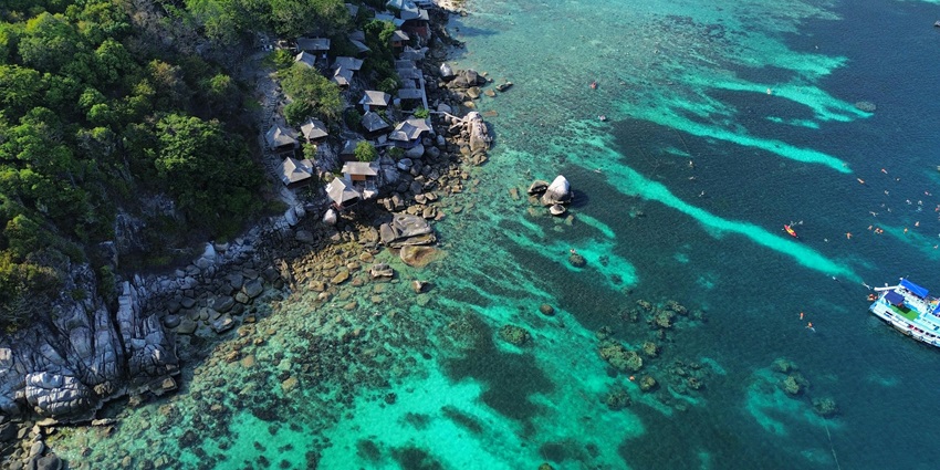Unwind on the white sands of Ao Leuk Beach, then dive in to snorkel among vibrant coral formations.