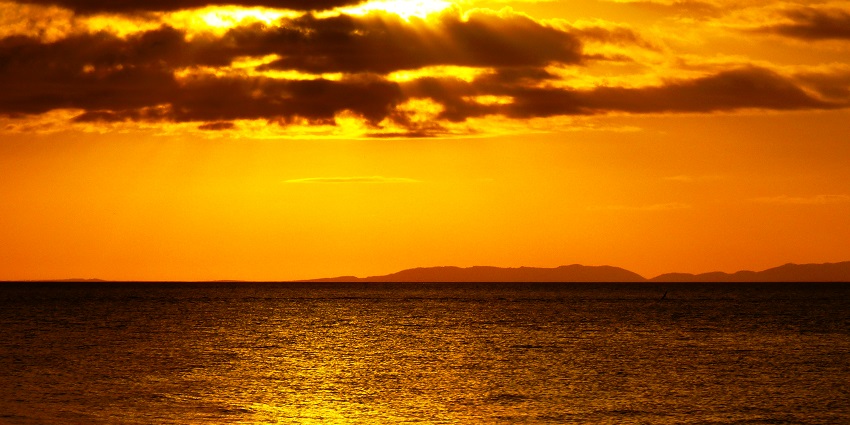 Sunset over Donsol's tranquil waters- one of the top things to do in Bicol Philippines