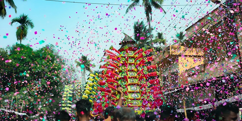 People celebrate the Tabuik Festival with confetti - Festivals In Indonesia.