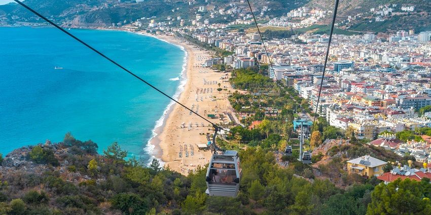 An image of people taking a ride on the Teleferik, one of the best things to do in Alanya Turkey