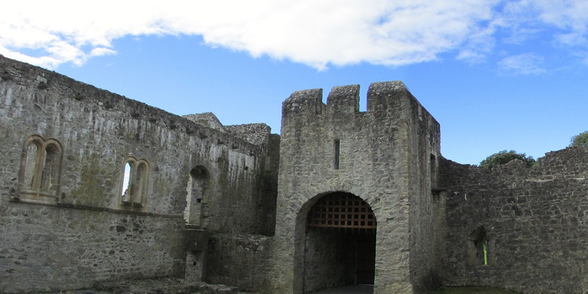 People exploring the architecture of Desmond Castle among things to do in Adare, Ireland.