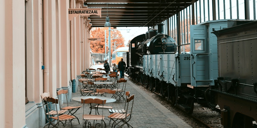 An image of the interior of Barstow Station building with train-themed decor and shops.