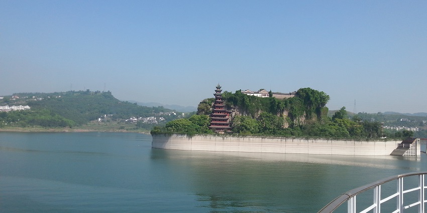 Embark on a scenic cruise along the Yangtze River, with views of cliffs, misty gorges, and ancient villages.