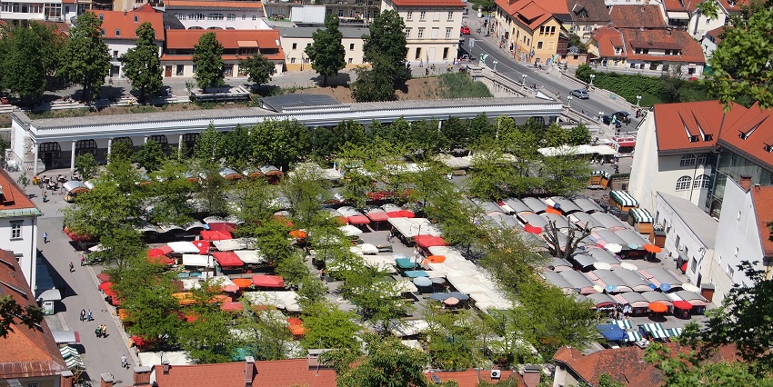Sample Slovenian cuisine and shop for fresh produce at the bustling riverside Central Market.