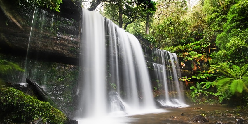 Tello Waterfall in Cameroon cascading down rocky cliffs, surrounded by lush greenery, with waterfalls in Cameroon.