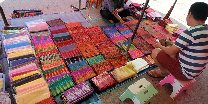 An image of vibrant Thai silk fabrics, one of the famous things to buy in Thailand.