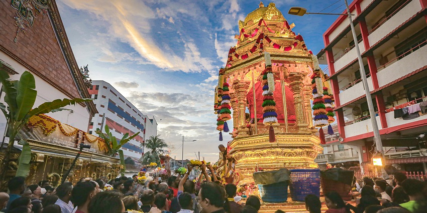 Devotees with a large decorated kavadi perform a ritual during the Thaipusam festival, one of the top festivals in Malaysia.
