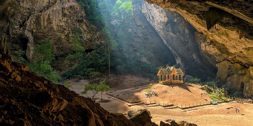 An image of the Buddha statues lined inside the sacred Tham Pa Fa cave