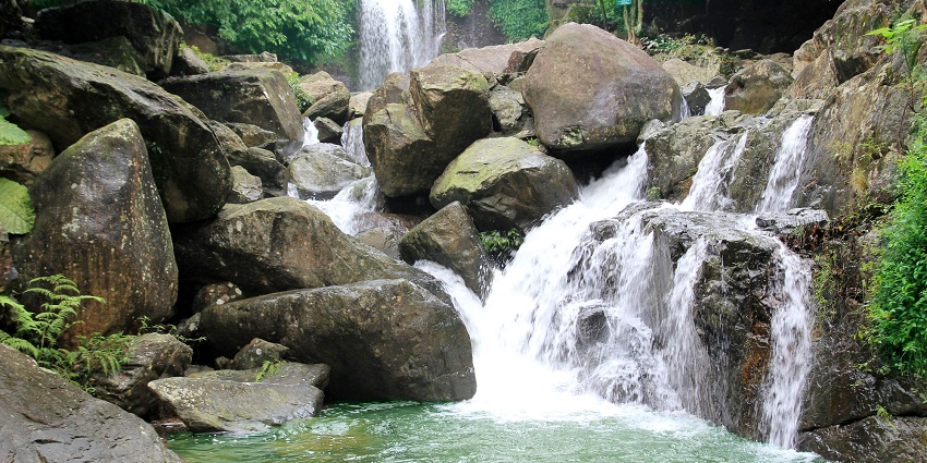 Cascading, crystal clear water of the Tien Sa Waterfall, in Cat Cat Village, Vietnam