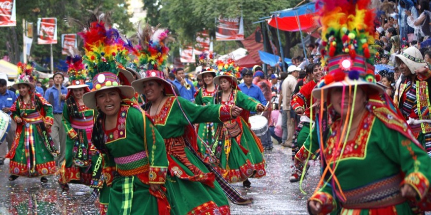 Traditional dancers in vibrant attire during Bolivia’s intense and sacred Tinku fertility festival.