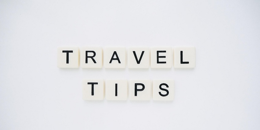 An image spelling 'TRAVEL TIPS' on background, suggesting helpful advice for travellers