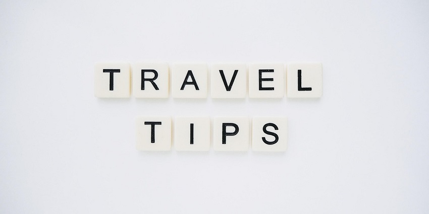 An image spelling 'TRAVEL TIPS' on background, suggesting helpful advice for travellers