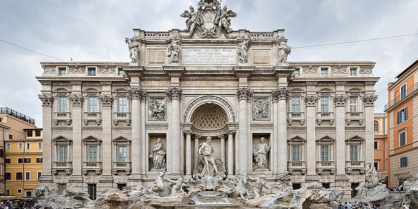 Toss a coin in the Trevi Fountain,an iconic tradition and must-do activity in Rome in July