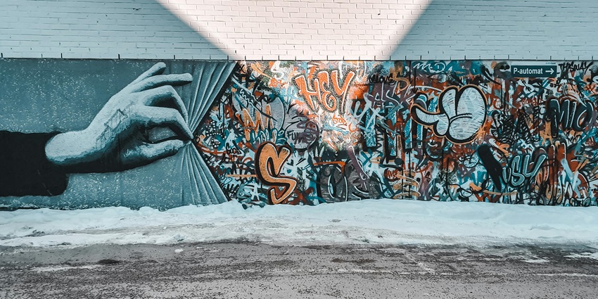 A photo showing a painted mural on a building wall along Main Street, one of the top things to do in Barstow CA.