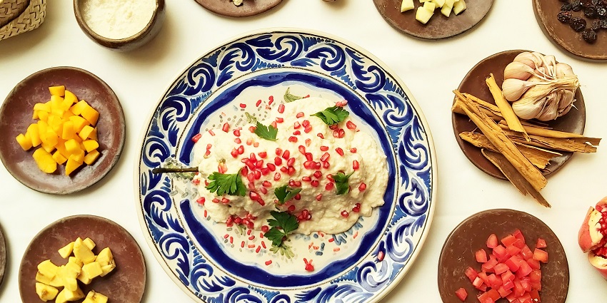 Traditional Mexican dish Chiles en Nogada presented with its ingredients, including walnut