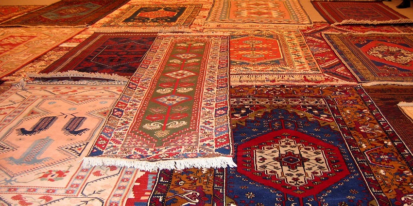 Handwoven carpets and kilims with intricate patterns, among the things to buy in Istanbul.
