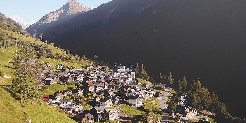 Val de Bagnes Valley with a road, buildings, and towers in scenic valleys in Switzerland.