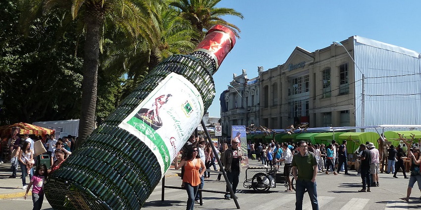 People celebrating Vendimia Festival with grape stomping, folk music and traditional dancing.