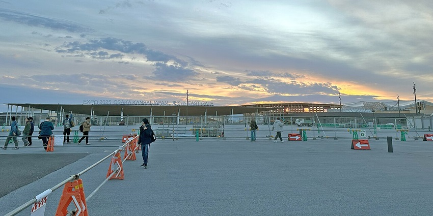 Venue of World Expo 2025 in Osaka with distant signages, fencings and people walking around
