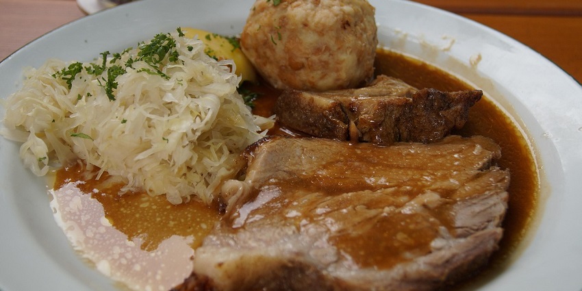 An image showing a view of Vepřo knedlo zelo, one of the best food in Czech Republic.