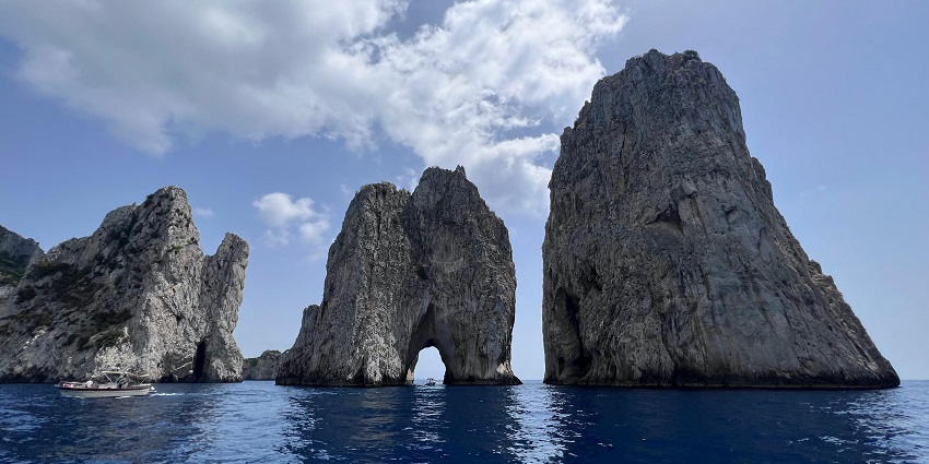 Admire the towering limestone rock formations off the coast of Capri, a hallmark of the island’s beauty.