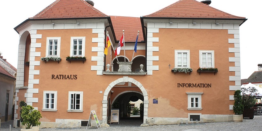 town hall in Rust, Burgenland, featuring Baroque architecture and a prominent clock tower.