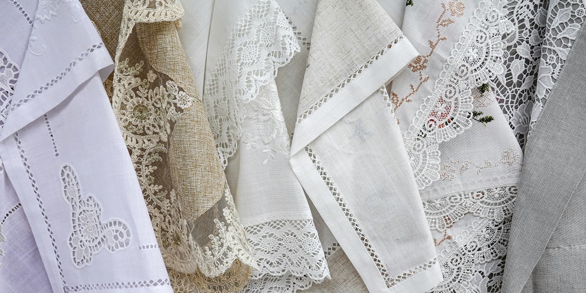 Image of handkerchiefs of different fabrics in a market, similar to the Bamako Artisanal Market.