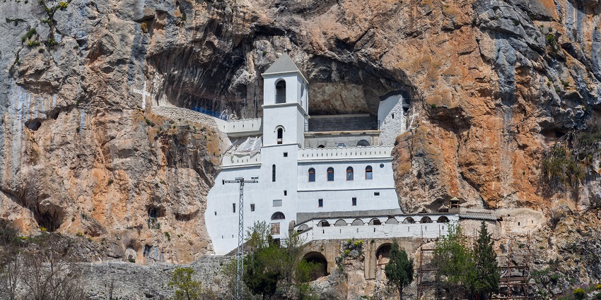 Visit the dramatic Ostrog Monastery, built into a cliff, offering a peaceful retreat and stunning views of the surrounding valley.