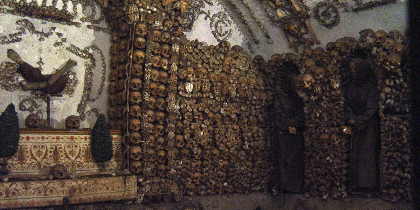 A picture of a historical site in Rome, decorated with skulls and skeletal remains