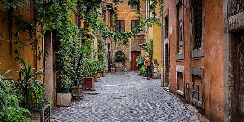 Trastevere's nighttime appeal includes cobblestone streets, soft lighting, and local life