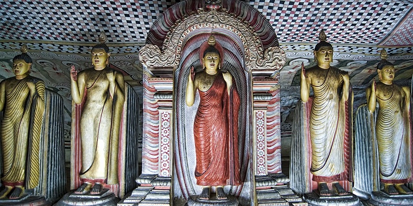 Marvel at Buddha statues in cave temples carved into rock, rich in spiritual significance.